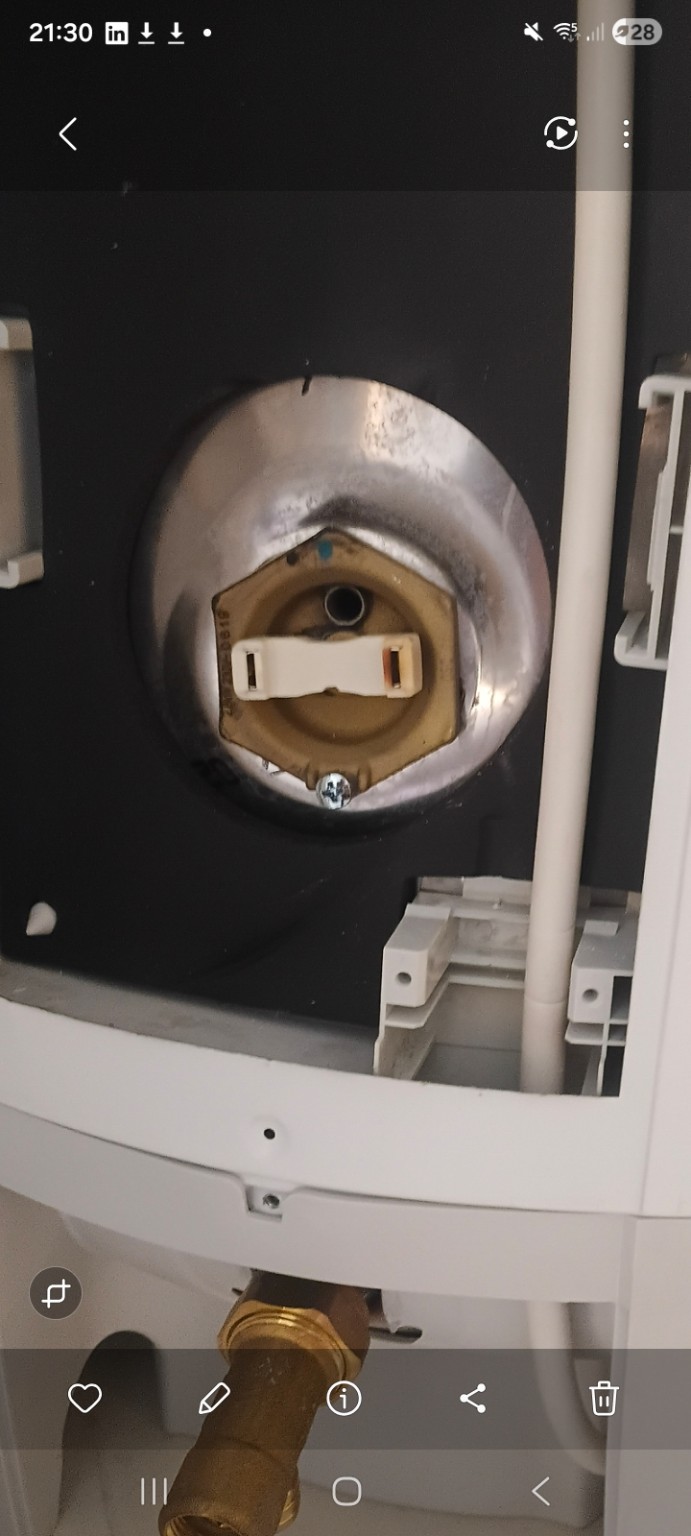 Immersion thermostat photographed with its cover removed during professional servicing